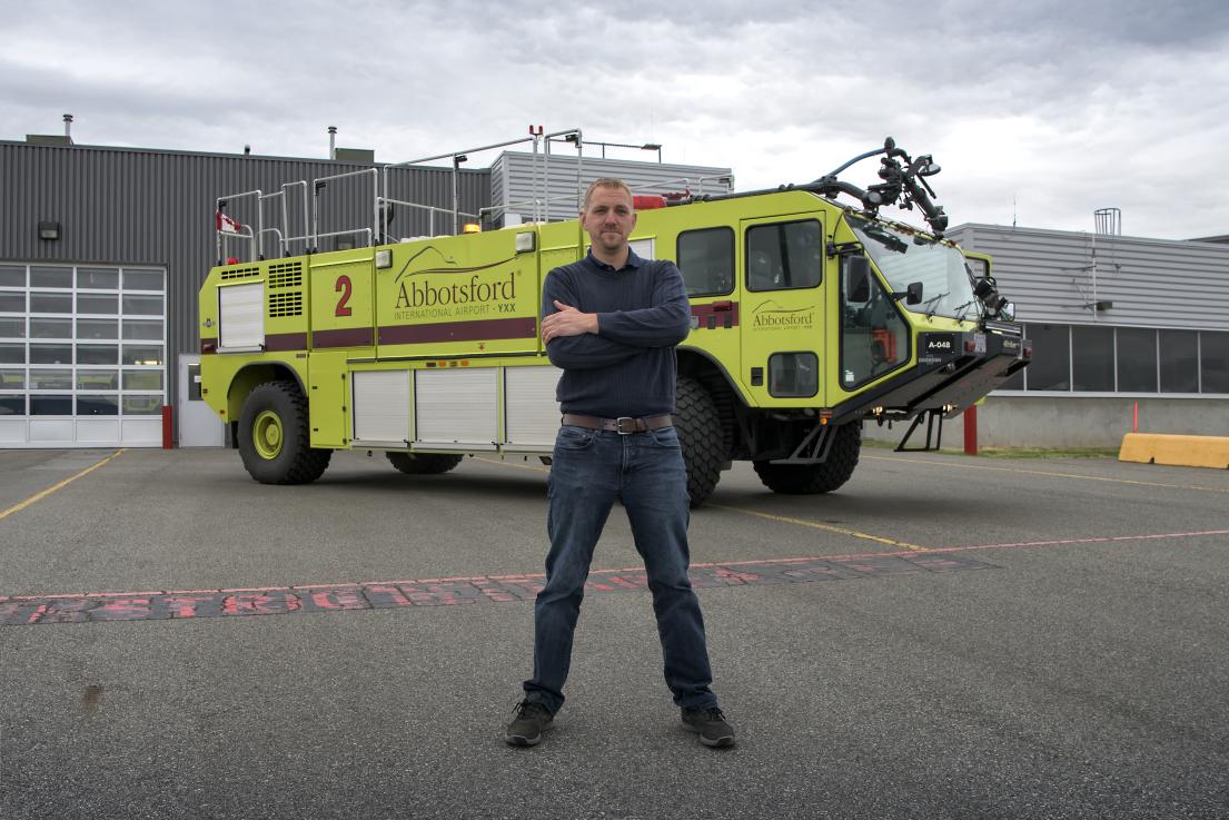 Duty officer in front of ARFF Truck