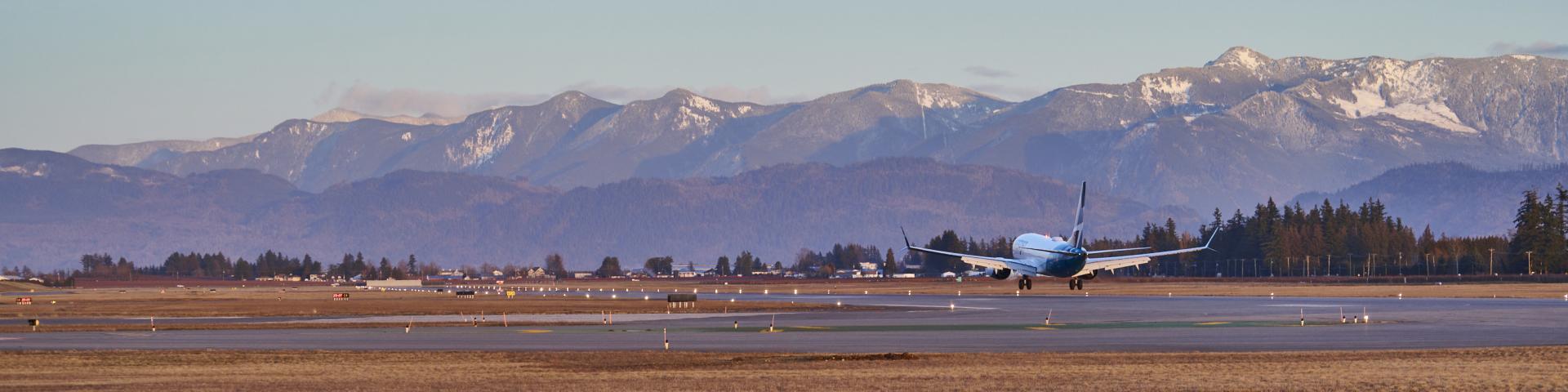 Image of plane on runway taking off